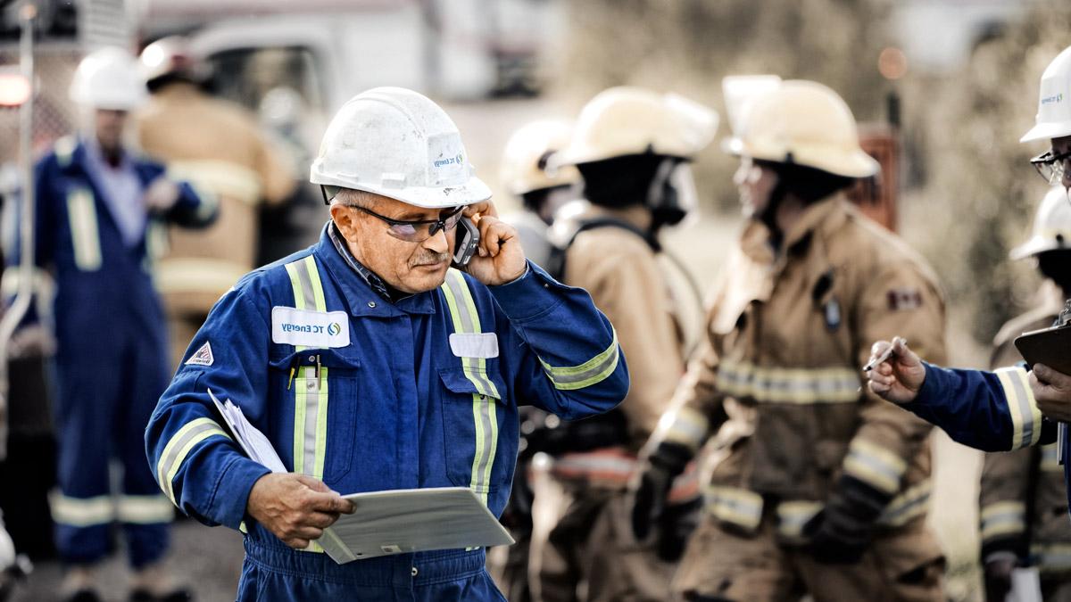 Man and woman monitoring pipelines.